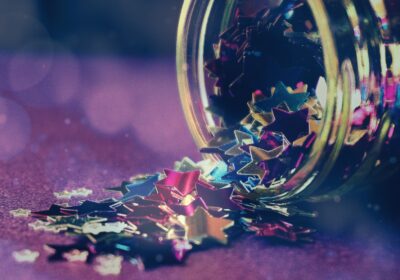 A jar of stars confetti, spilling out