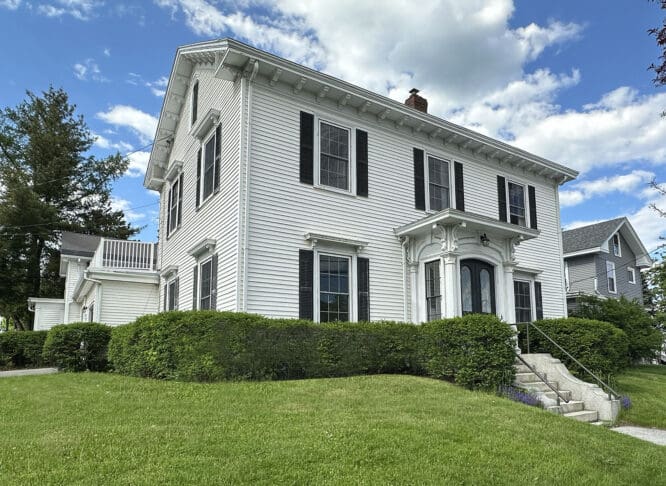 picture of a white 3-story house