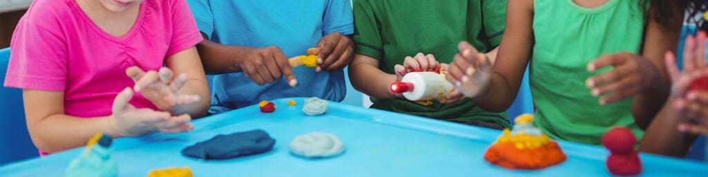 Children express their creativity through modeling clay