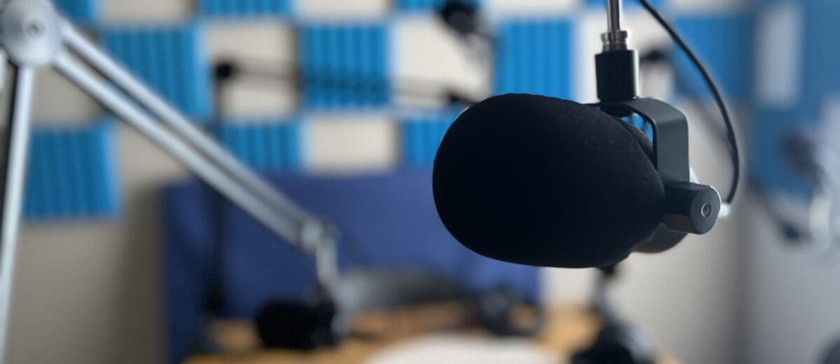 The podcasting studio of Sutherland Weston, with a microphone pointed towards the camera